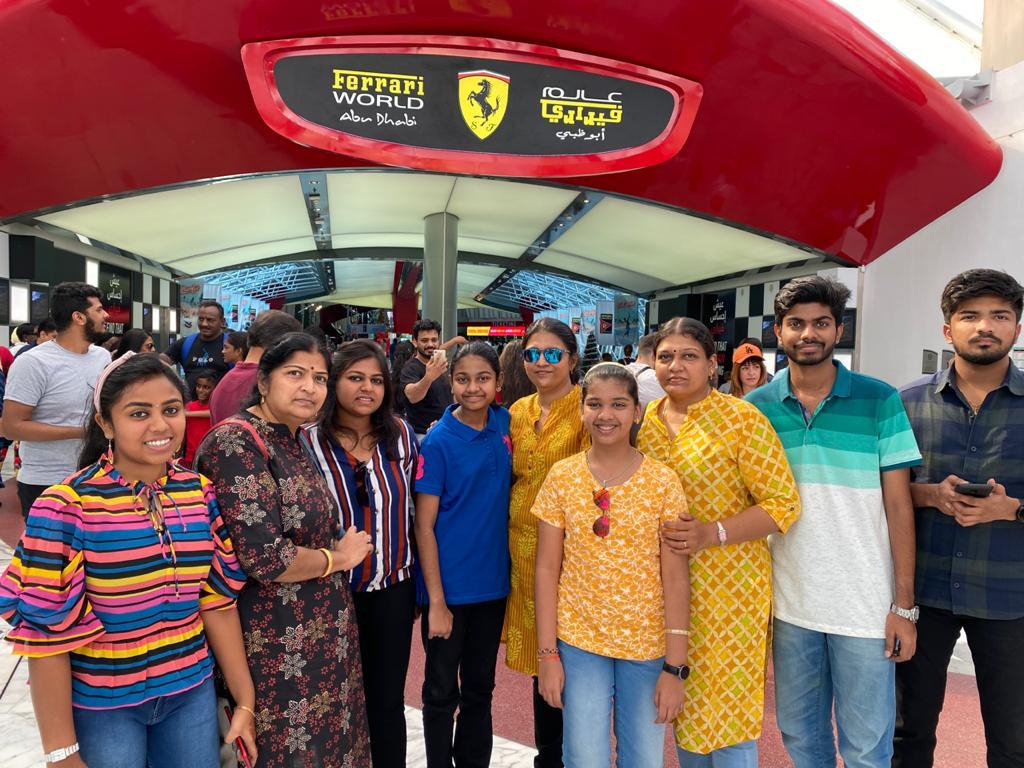 Friends smiling for a second group photograph at the same gathering